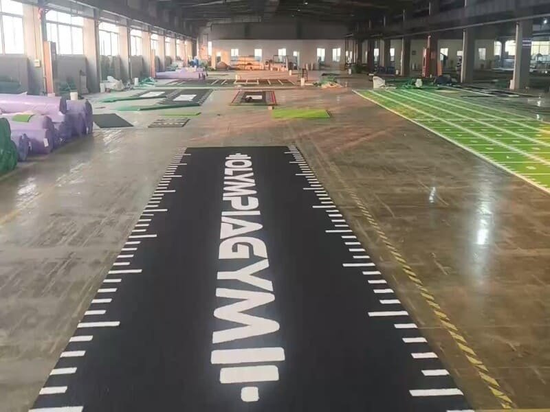 Gym turf installation with integrated LED lighting strips for enhanced zone visibility in dark fitness facilities